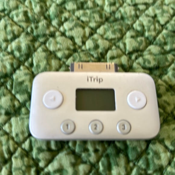 Itrip. Covert your iPod to play through a radio station in your car. . - Picture 1 of 2